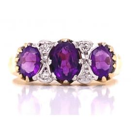 18ct Three Amethyst Four Diamond Ring image