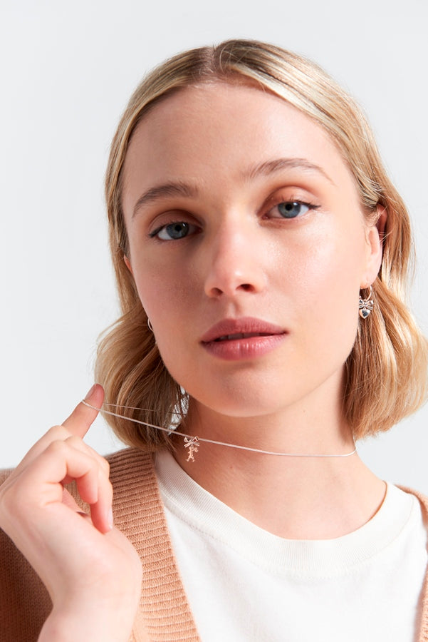 9ct yellow gold mini girl with a bow hoop earrings