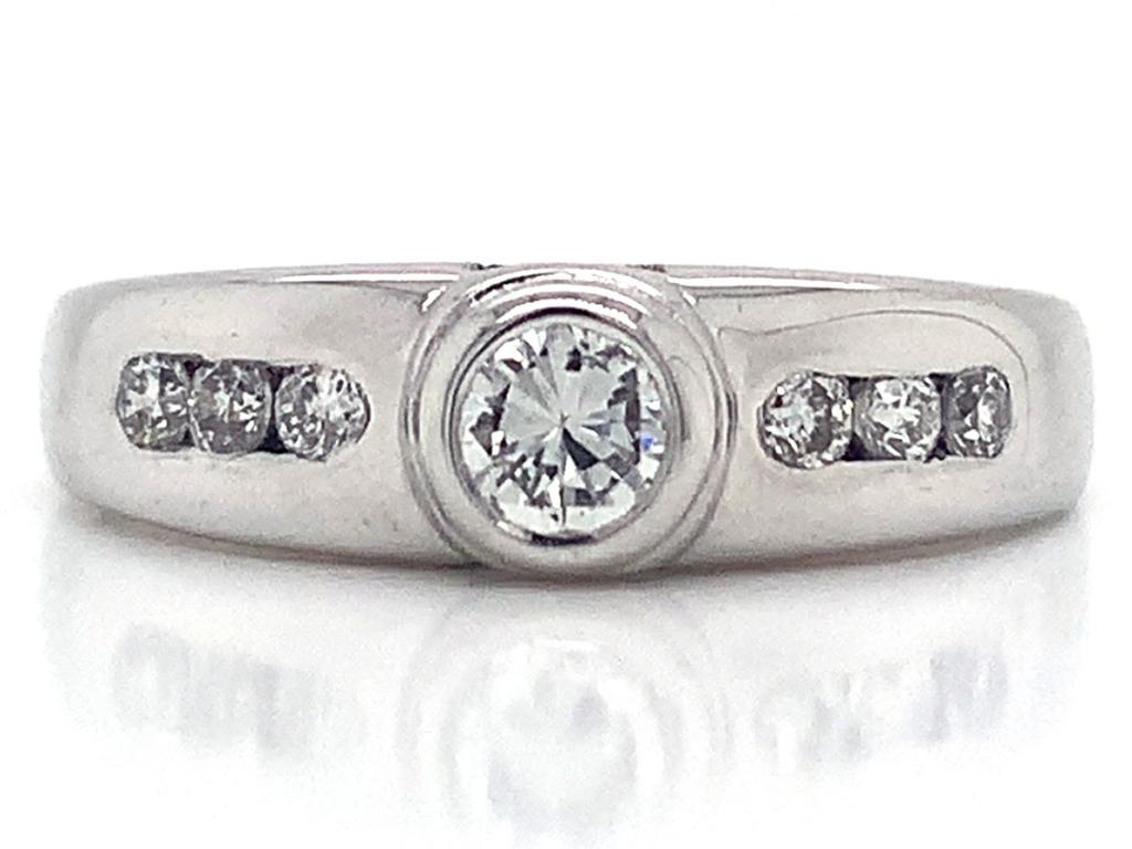 3811383 18ct white gold diamond rubover solitaire ring tdw 0
