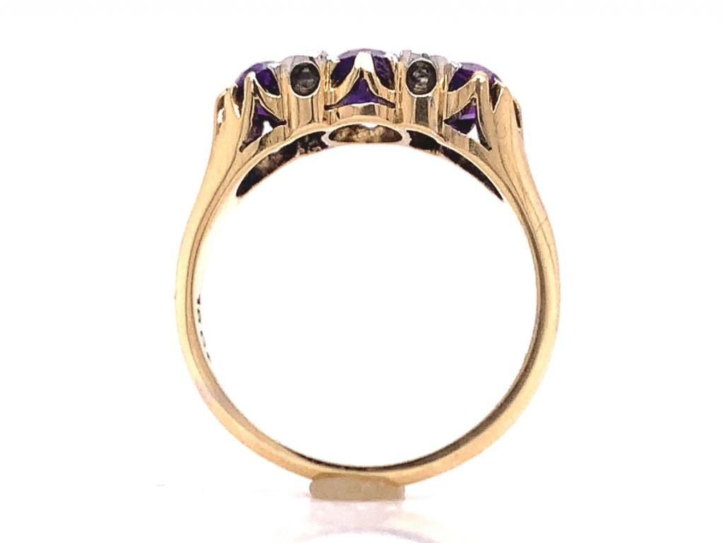 18ct three amethyst four diamond ring