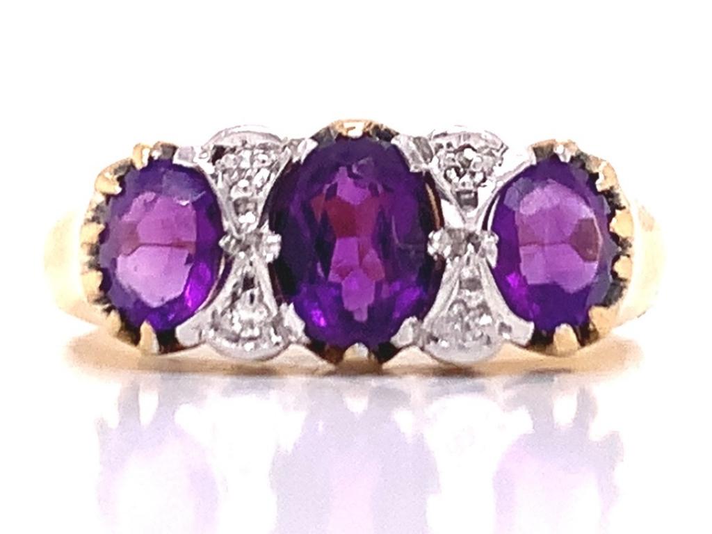 18ct Three Amethyst Four Diamond Ring