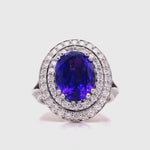 Load and play video in Gallery viewer, 18ct Two Tone Tanzanite Diamond Oval Cluster Ring TDW 1.08ct
